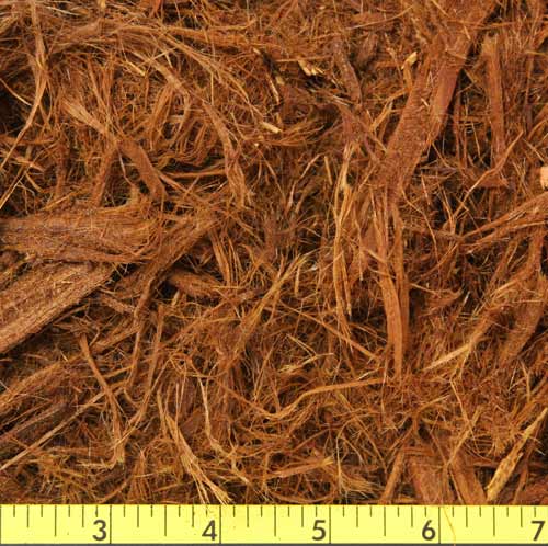 Single grind redwood bark, also known as Gorilla Hair, fibrous stringy mulch in dark red